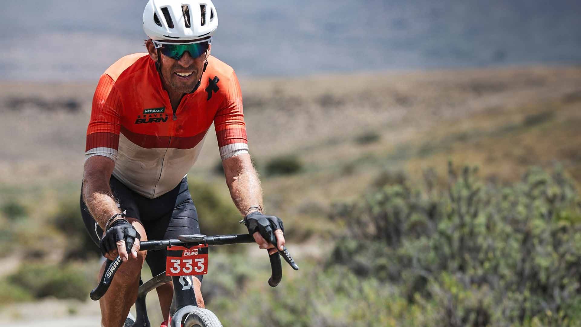 An age-group rider racing on Karoo gravel