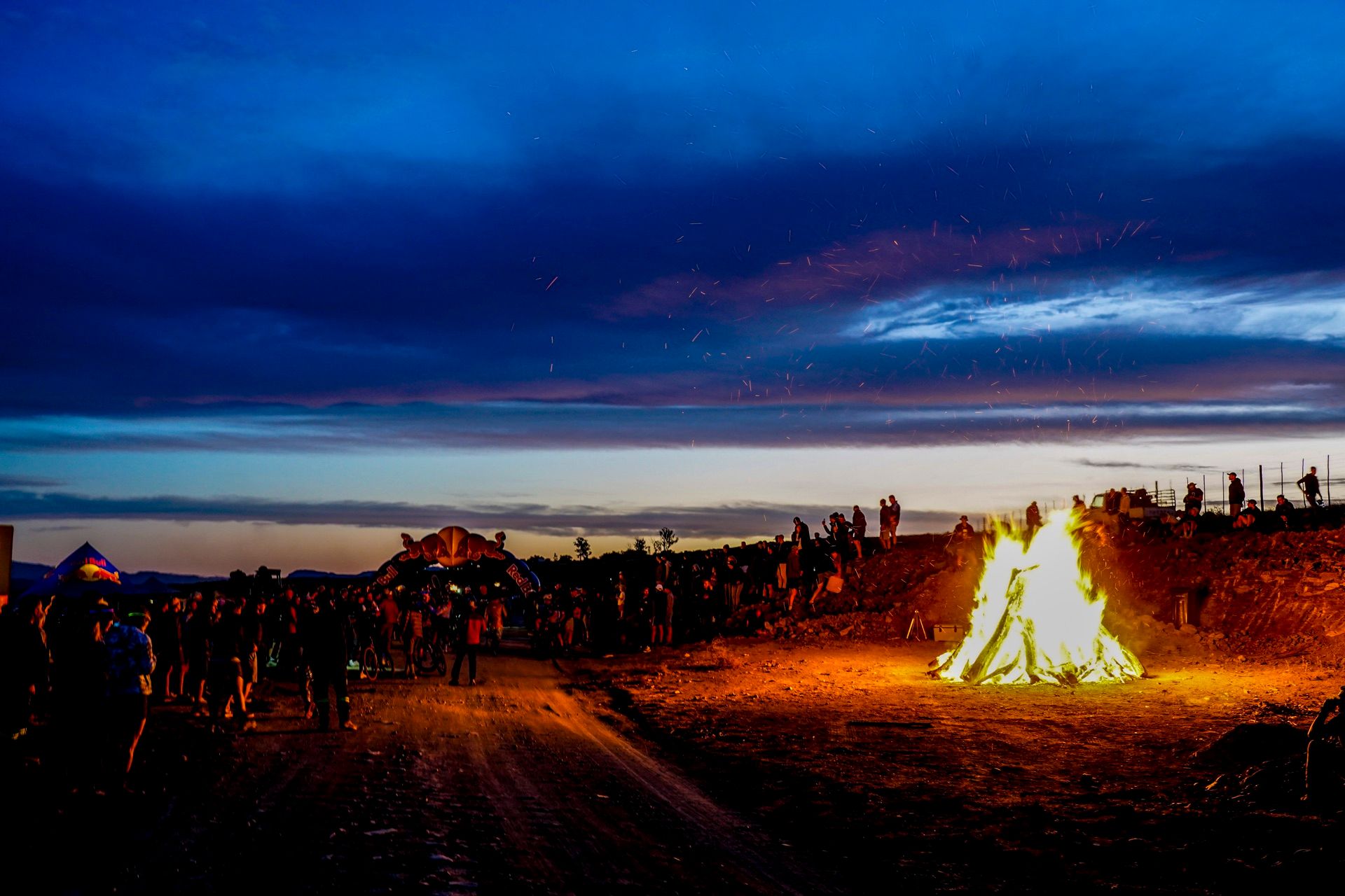 A huge bonfire lighting up the Night Burn crowd at dusk